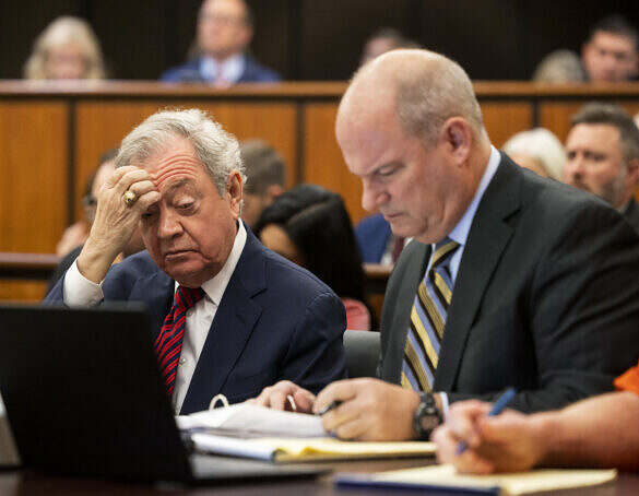 Defense attorneys Dick Harpootlian (left) and Jim Griffin look over materials at a status conference to discuss an upcoming hearing on Alex Murdaugh’s jury-tampering allegations against Colleton County Clerk of Court Rebecca “Becky” Hill to be ruled by former S.C. Chief Justice Jean Toal at the Richland County Judicial Center on Monday, Jan. 16, 2024, in Columbia, S.C. Gavin McIntyre/The Post and Courier/Pool
