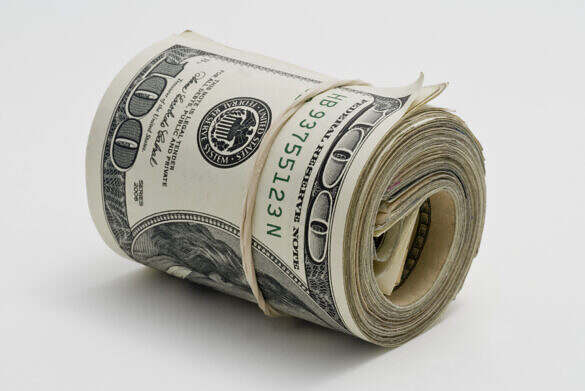 Wad of one hundred dollar bills secured with a rubber band.