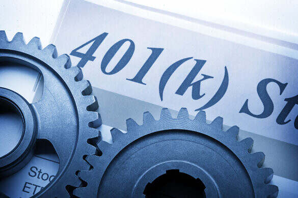 Two interlocking gears sit on top of a 401k statement.  A strong blue cast dominates the image.